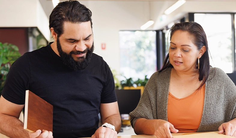 Aboriginal colleagues working on a project together in an office